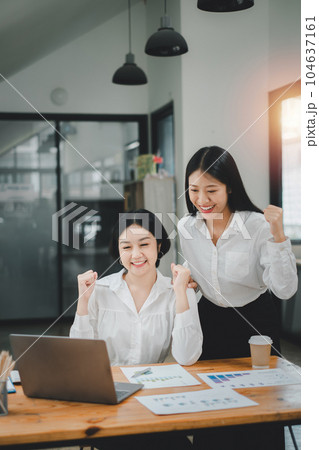 Beautiful two asian girl celebrate with laptop, success happy pose, E-commerce, university education, internet technology, or startup small business concept. Beautiful two asian girl celebrate with laptop, success happy pose, E-commerce, university education, internet technology, or startup small business concept. 104637161