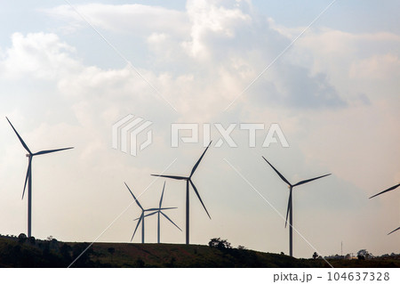 Wind turbines on sunny morning Wind turbines on sunny morning 104637328