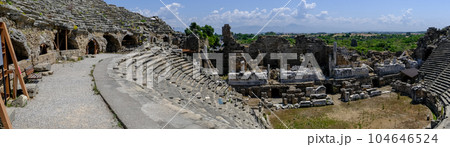 Side Ancient theatre. Turkey. Antalya. Ruins of the ancient city of Side. The largest amphitheater in Turkey. Main street of the ancient city. Mediterranean Sea. 104646524