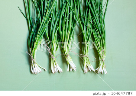 Green onions, fresh greens on the table, organic food 104647797