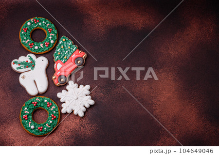 Beautiful delicious Christmas gingerbread on a concrete texture background 104649046