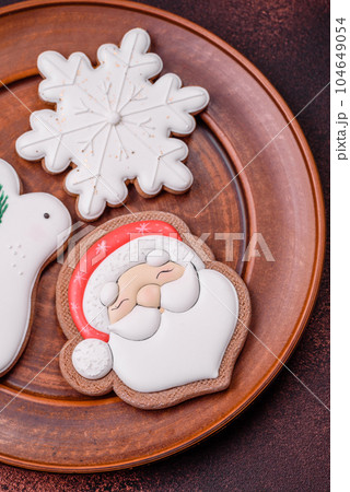 Beautiful delicious Christmas gingerbread on a concrete texture background 104649054