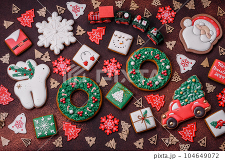 Beautiful delicious Christmas gingerbread on a concrete texture background 104649072