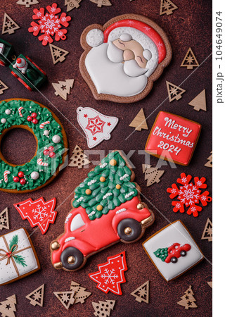 Beautiful delicious Christmas gingerbread on a concrete texture background Beautiful delicious Christmas gingerbread on a concrete texture background 104649074