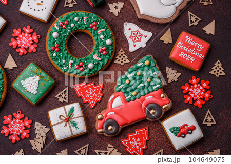 Beautiful delicious Christmas gingerbread on a concrete texture background Beautiful delicious Christmas gingerbread on a concrete texture background 104649075