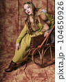 glamorous portrait of a beautiful young woman in a fur vest holding a bag 104650926