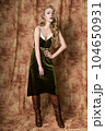 Beautiful fashion model in a velvet green dress. Vintage. Luxury style. 104650931