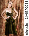 Beautiful fashion model in a velvet green dress. Vintage. Luxury style. 104650933