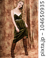 Beautiful fashion model in a velvet green dress. Vintage. Luxury style. 104650935