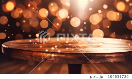 Empty wooden table top in front of abstract blurred background with garlands of lights, cozy cafe bar small restaurant 104651786