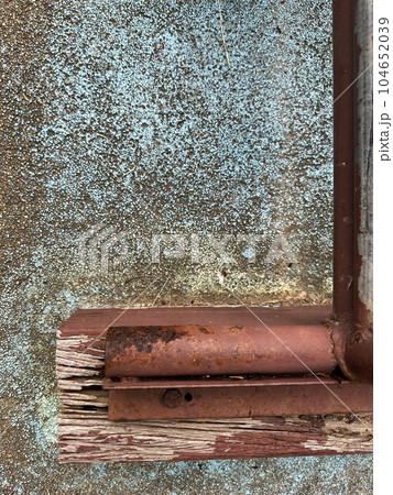 rusty metal door with a rust background, concrete in dark grey and teal green color 104652039