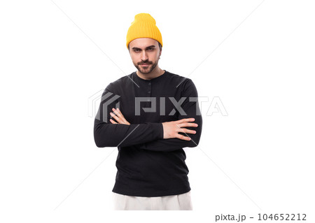 young handsome caucasian brunette man with beard in informal style on white background with copy 104652212