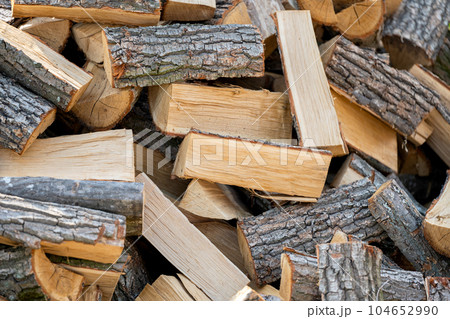 pile of chopped firewood close up 104652990