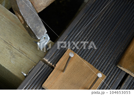 Construction and assembly of larch floor. Outdoors. Construction and assembly of larch floor. Outdoors. 104653055