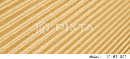 Brown and beige colored corrugated cardboard detail Brown and beige colored corrugated cardboard detail 104654095