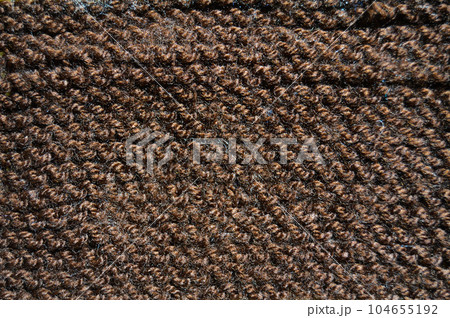 Handmade knitted fabric brown wool background texture Handmade knitted fabric brown wool background texture 104655192