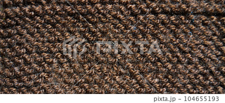 Handmade knitted fabric brown wool background texture Handmade knitted fabric brown wool background texture 104655193