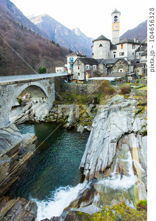 River, bridge, buildings in the town of Lavertezzo. Switzerland. Alps 104656328