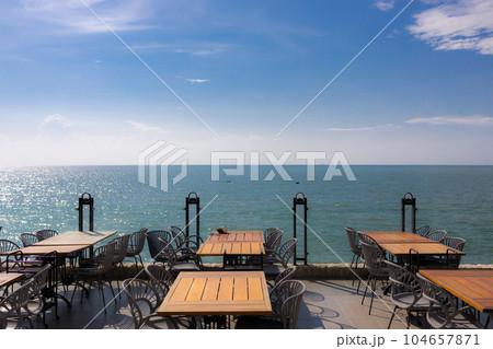 Summer terrace with stylish trendy outdoor furniture at a luxurious travel destination. Summer terrace with stylish trendy outdoor furniture at a luxurious travel destination. 104657871