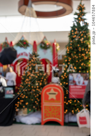 Defocused outlet mall Christmas backdrop for Santa pictures 104657884