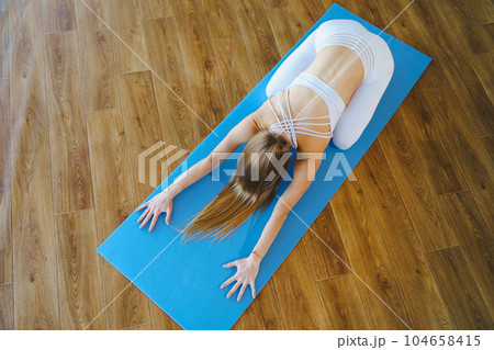 Sporty Woman's Morning Stretching Session Sporty Woman's Morning Stretching Session 104658415