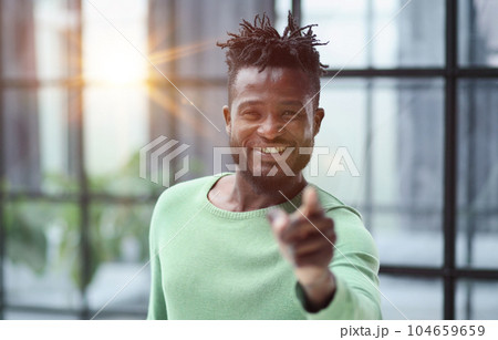 Handsome businessman pointing his finger to the camera 104659659