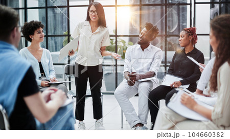 business training and coaching in company. Speaker talking in front of meeting room. 104660382