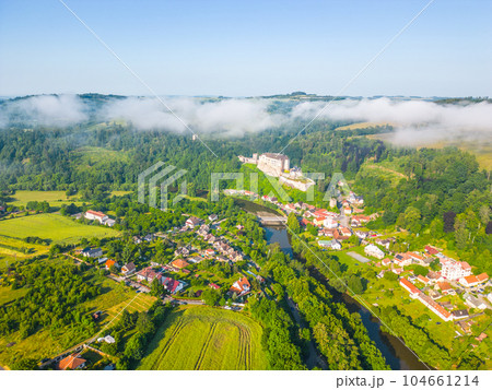 Cesky Sternberk castle and town at Sazava River on sunny summer morning. Aerial view from drone. 104661214