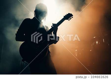 Rock guitar player smoke. Band play. Fictional person. Generate Ai Rock guitar player smoke. Band play. Fictional person. Generate Ai 104661626