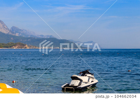 Empty jet ski on a blue sea of Kemer, Turkey. Summer vacation concept Empty jet ski on a blue sea of Kemer, Turkey. Summer vacation concept 104662034