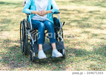 Depressed sad asian woman in wheelchair lonely disabled adult 104671303