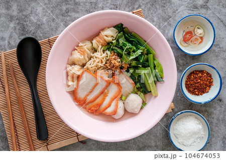 Chinese egg noodles with red pork in hot soup Chinese egg noodles with red pork in hot soup 104674053