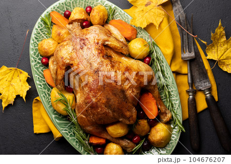 Thanksgiving turkey on rustic table Thanksgiving turkey on rustic table 104676207