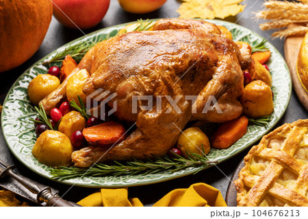 Thanksgiving turkey on rustic table Thanksgiving turkey on rustic table 104676213