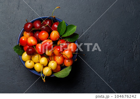 A vibrant and colorful cherry, bursting with sweet juiciness 104676242