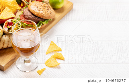 Mexican food featuring tacos, burritos, nachos, burgers Mexican food featuring tacos, burritos, nachos, burgers 104676277