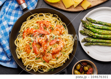 A delightful Italian pasta adorned with shrimps A delightful Italian pasta adorned with shrimps 104676301