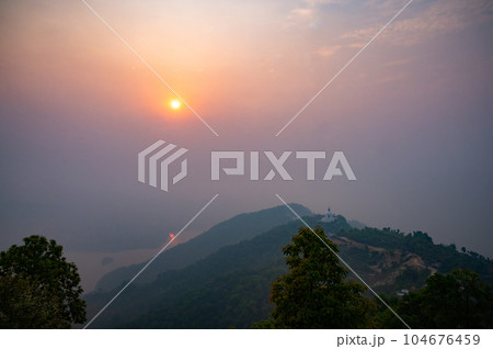 A landscape of World Peace Pagoda or Pokhara Shanti Stupa, a Buddhist monument on Anadu Hill, Pokhara, Nepal A landscape of World Peace Pagoda or Pokhara Shanti Stupa, a Buddhist monument on Anadu Hill, Pokhara, Nepal 104676459