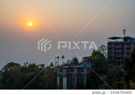A landscape around Nargakot village at sunrise on a foggy day. Nargakot located at the rim of the Kathmandu Valley. It's known for its views of the Himalayas, including Mount Everest A landscape around Nargakot village at sunrise on a foggy day. Nargakot located at the rim of the Kathmandu Valley. It's known for its views of the Himalayas, including Mount Everest 104676460
