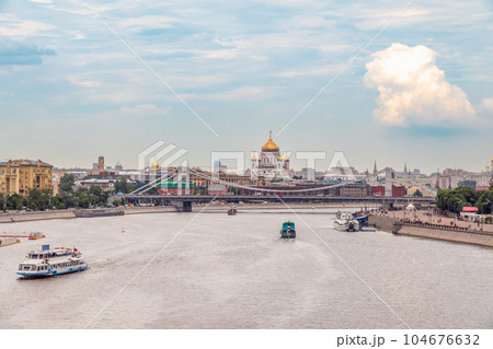 Cruise ship sails on the Moscow river in Moscow city center, popular place for walking. 104676632