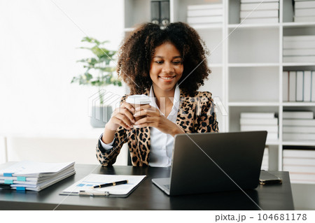 Business woman using tablet and laptop for doing math finance on an office desk, tax, report, accounting, statistics, and analytical research concept in office Business woman using tablet and laptop for doing math finance on an office desk, tax, report, accounting, statistics, and analytical research concept in office 104681178