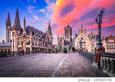 Gent, Belgium. Graslei historical downtown, River Leie and bridge Sint-Michielsplein. Gent, Belgium. Graslei historical downtown, River Leie and bridge Sint-Michielsplein. 104685792