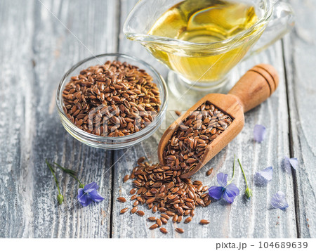 Flax seeds and flaxseed oil with copy space Flax seeds and flaxseed oil with copy space 104689639