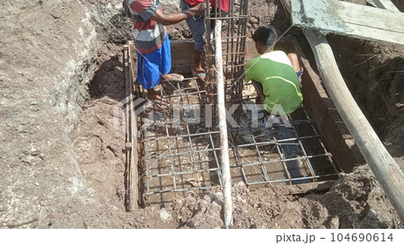Foundation site of new building, details and reinforcements with steel bars and wire rod Foundation site of new building, details and reinforcements with steel bars and wire rod 104690614
