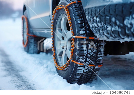 Car with chain attached to it's front tire in the snow. Generative AI 104690745