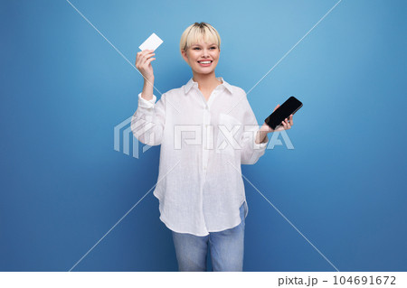 young positive caucasian office worker woman with a bob haircut and dressed in a white blouse uses young positive caucasian office worker woman with a bob haircut and dressed in a white blouse uses 104691672