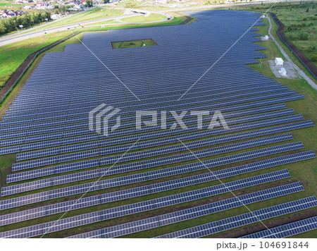 Ecology solar power station panels in the green fields Ecology solar power station panels in the green fields 104691844