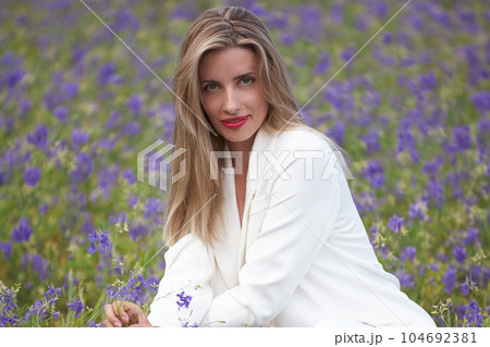 Girl in a flower field Girl in a flower field 104692381