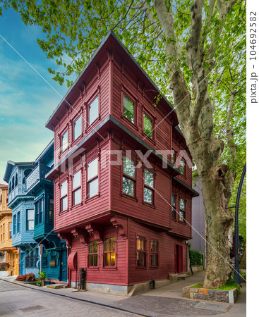 Facade of colorful wooden houses painted in red and blue, located in Kuzguncuk, Uskudar district, Istanbul, Turkey 104692582