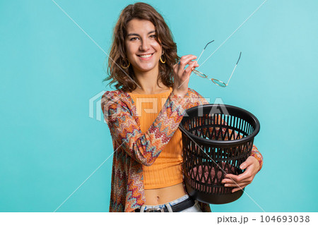 Woman taking off, throwing out glasses into bin after medical vision laser treatment therapy surgery Woman taking off, throwing out glasses into bin after medical vision laser treatment therapy surgery 104693038